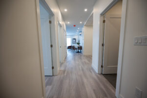 Hallway with doors and living area