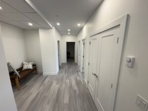 Hallway with doors and bench